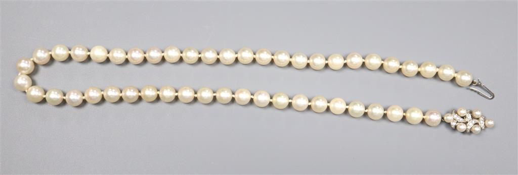A modern single strand cultured pearl necklace with diamond set 585 white metal, cultured pearl and diamond set clasp,